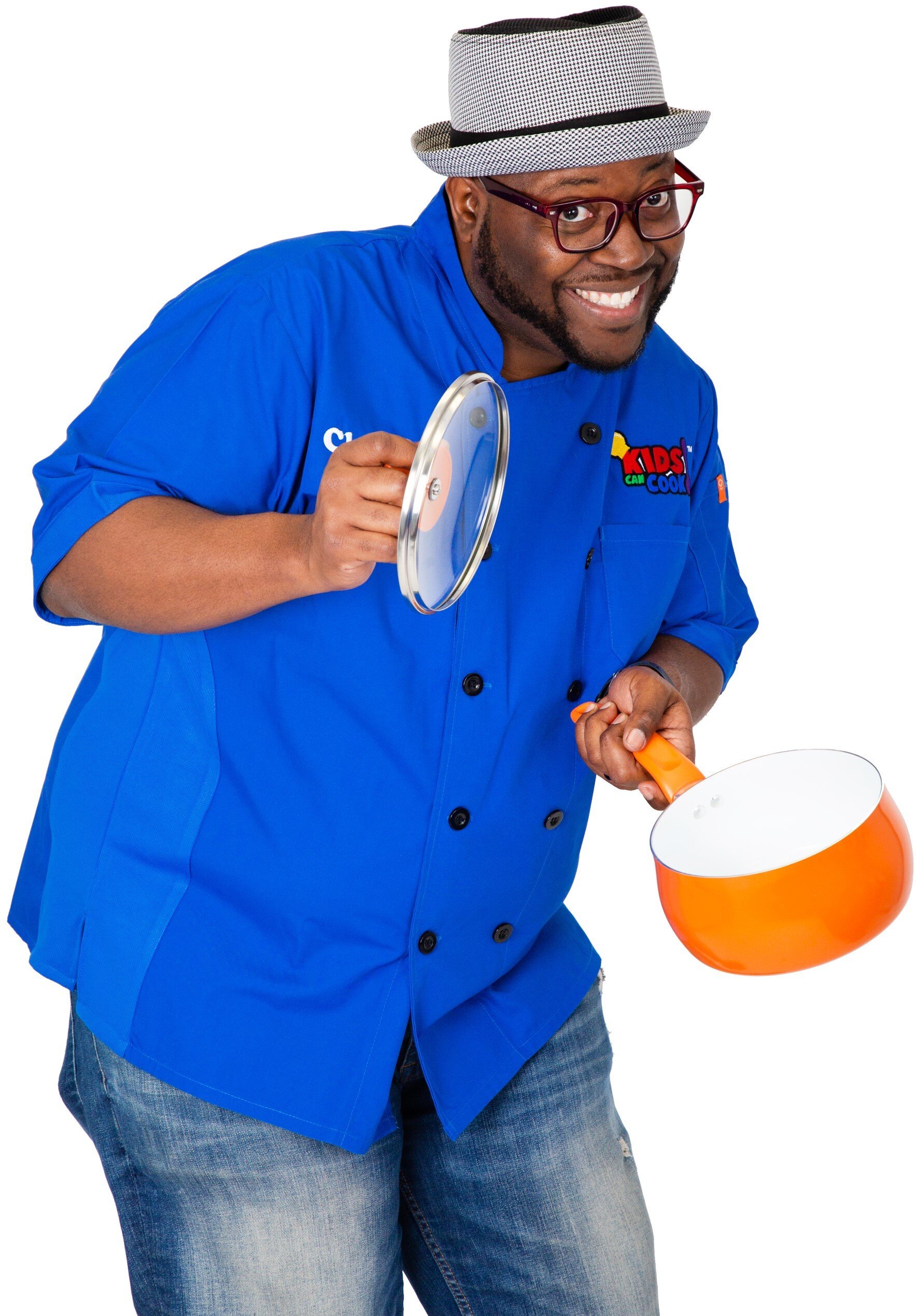 Photo of Chef Dario Stephen holding a pot and it's lid.