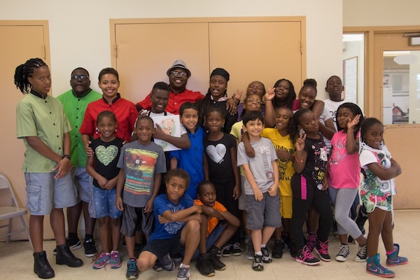 Photo of a group of kids taking a group photo