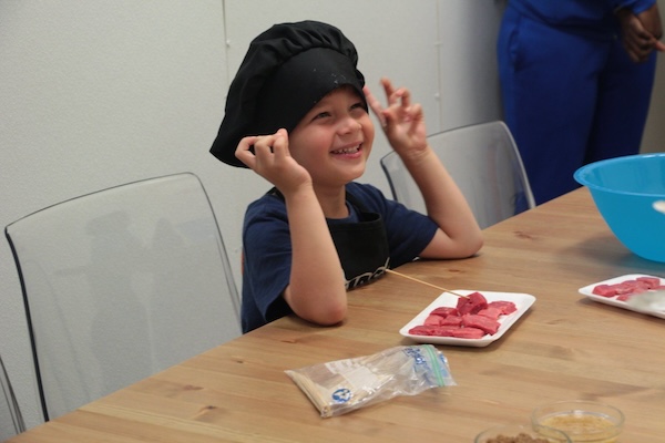 Smiling kid with a chef hat